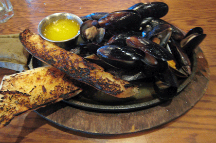 Pelican02 Sizzling mussels sautéed in white wine & garlic
