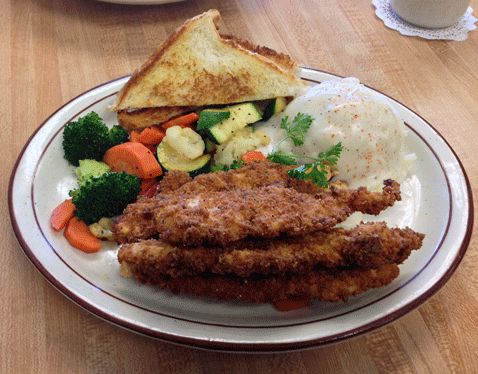 Chicken Tenders with housemade mashed potatoes and gravy and vegetable medley