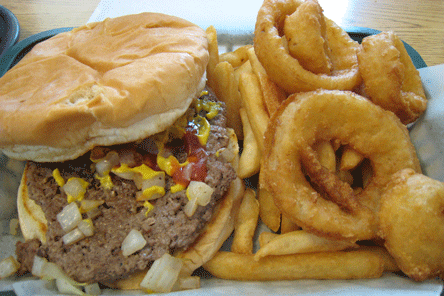Hamburger with French fries and onion rings at the Village Grill