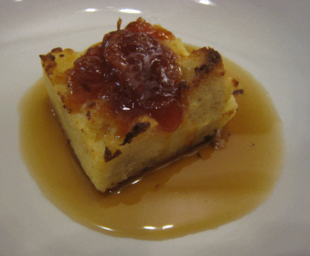 Warm bread pudding with a house-made plum jam and honey caramel