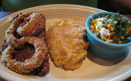 BBQ MEATLOAF Ancho BBQ glazed meatloaf, served with Chipotle Creamed Corn and Sweet Potato Mash - topped with Buttermilk Onion Rings 
