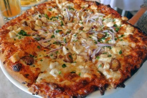 Barcelona Pizza: Marinara, chicken breast, mozzarella, cilantro, prosciutto & red onions