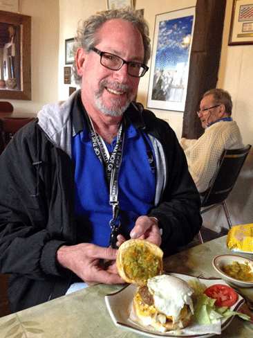 My friend Bruce "Sr Plata" Silver enjoys a green chile cheeseburger from Perea's Tijana Bar