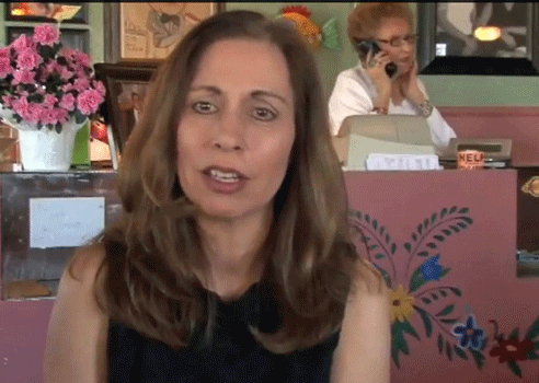 Antoinette Knight, co-owner of Mary & Tito's. In the background Mary is answering the phone.