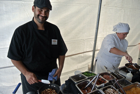 Chef Paco Aceves prepares an omelet (green chile, bacon, chorizo, onions, cheese) for me