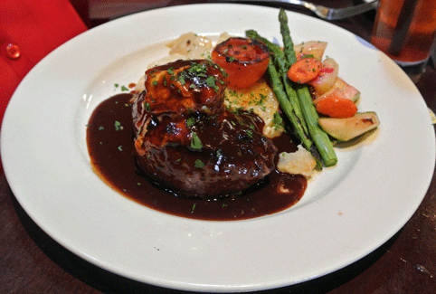London Steak: Pan-seared top round filet topped with bleu cheese and port wine demi sauce.