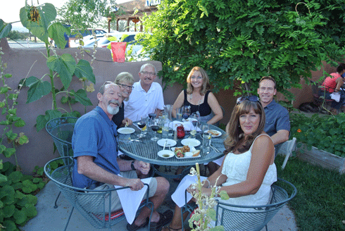 Happy patrons enjoying their dinner on the patio in a mid-August day 2013