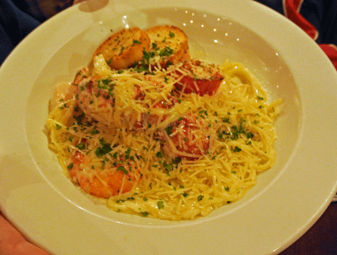 Con Frutti de Mar -- (The Fruit of the sea) Shrimp-Scallops-Lobster with white wine garlic cream sauce over linguini