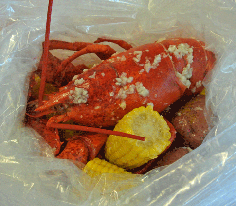 Two-pound lobster with potatoes and corn-on-the-cob